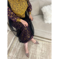 A traditional dress in light clover fabric in dark violet color