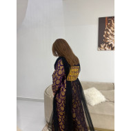 A traditional dress in light clover fabric in dark violet color