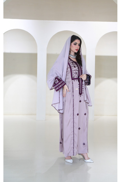 A long, flesh-colored Balochi dress