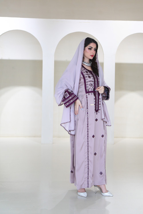 A long, flesh-colored Balochi dress