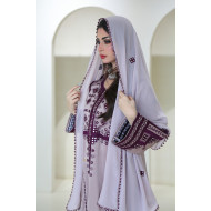 A long, flesh-colored Balochi dress