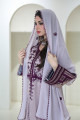 A long, flesh-colored Balochi dress