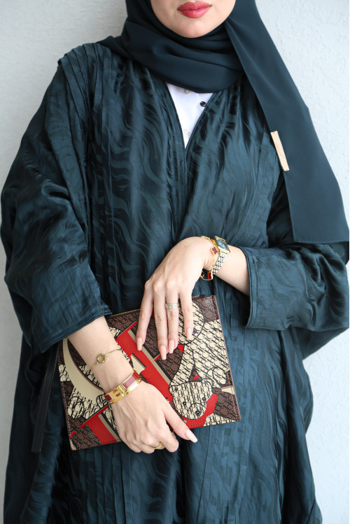 Bahraini turquoise abaya with pleats