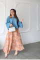 A sky blue linen shirt set with a rose on the shoulder and an apricot printed skirt