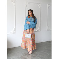 A sky blue linen shirt set with a rose on the shoulder and an apricot printed skirt