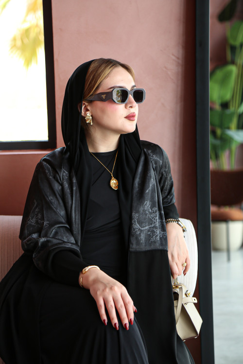 Soft abaya with raw material decorated on the upper part in gray