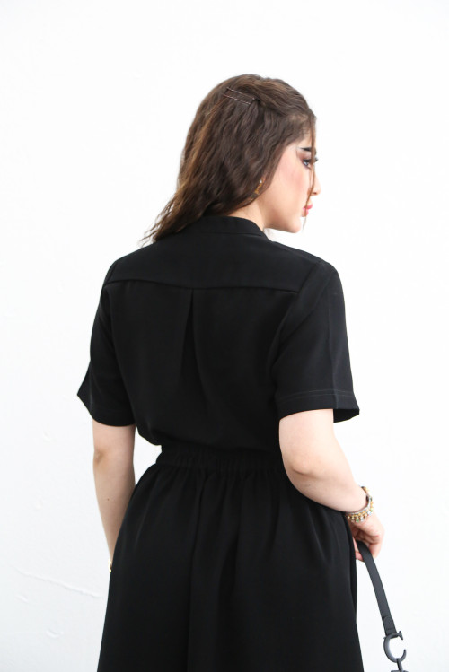 Black set with short-sleeved shirt and pleated skirt