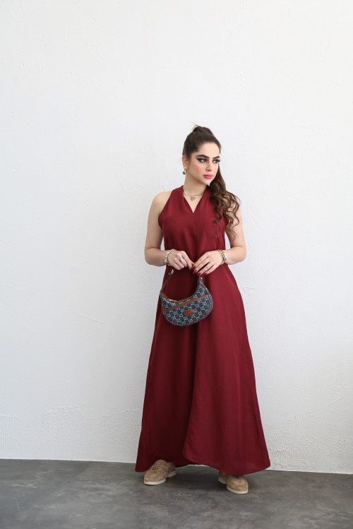 Long maroon dress with V-slit and tie-back design