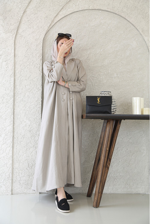 A beige cardigan abaya made of natural linen