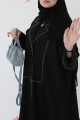 A practical black abaya with white threads 