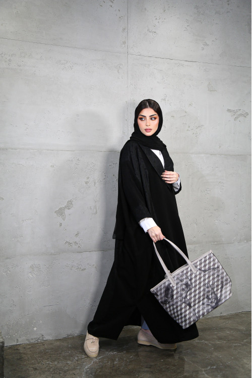 Abaya incorporating luxurious black materials
