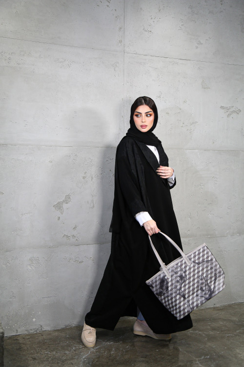 Abaya incorporating luxurious black materials