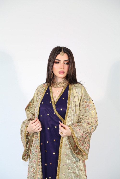 A luxurious pistachio bisht with a wrap dress