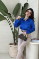 Silky blue shirt connected to the culottes