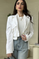 White jacket, luxurious material, with a prominent button and pockets